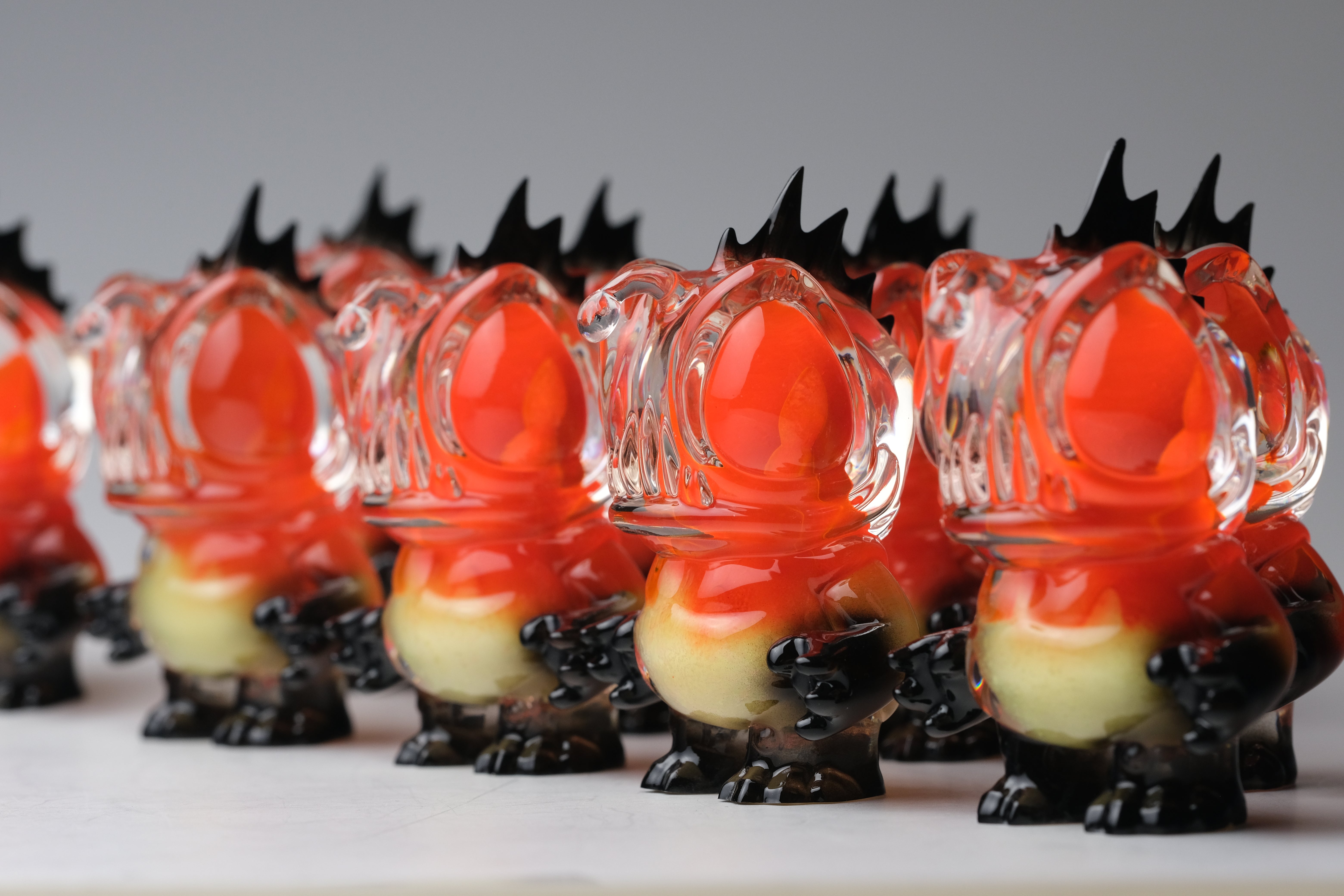 Angie Evo - Chicago Fire by 5th Turtle: Limited edition 3.5 resin figures with orange heads, black crests, and two-tone bodies, displayed in neat formation.