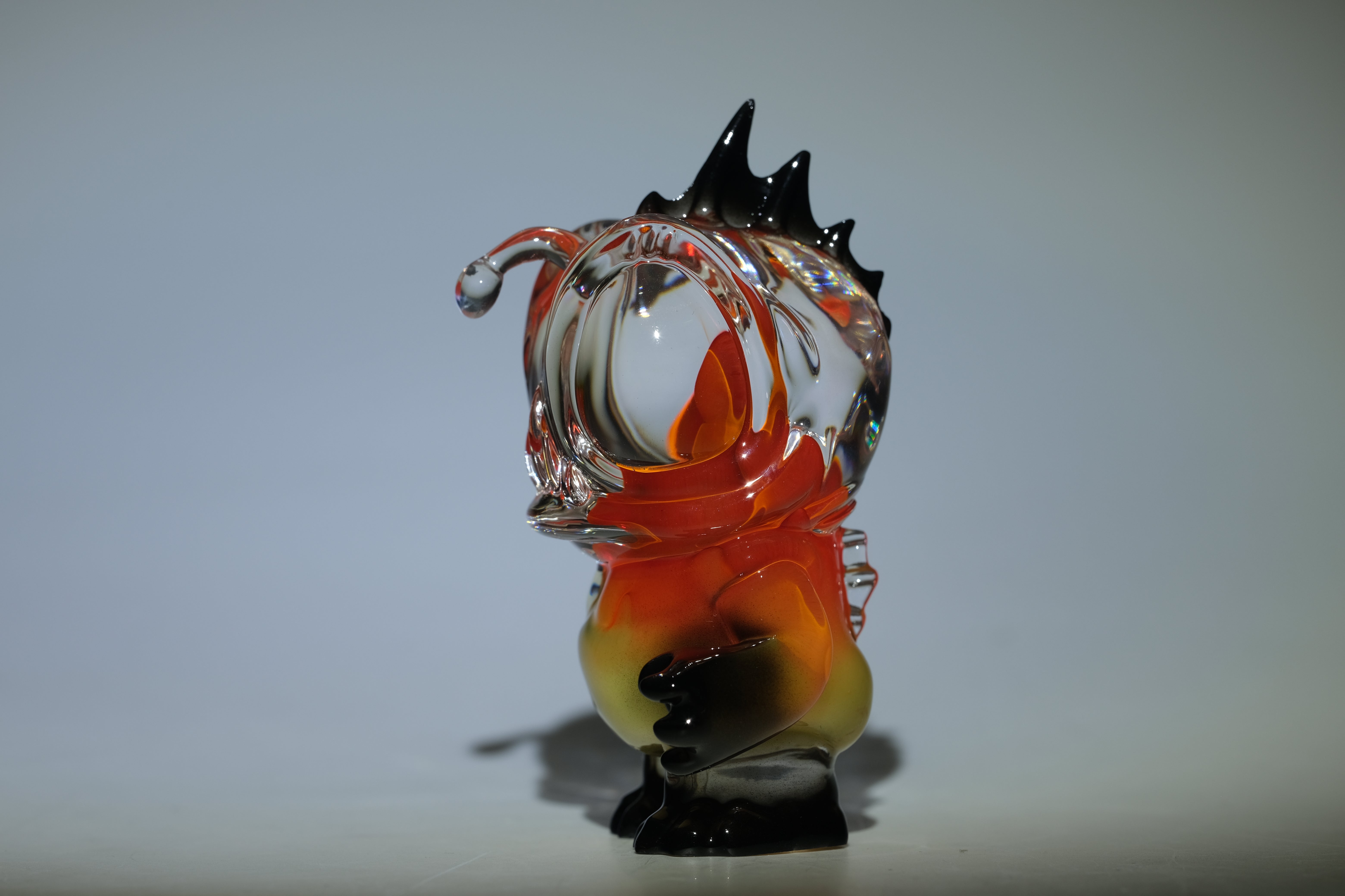 Angie Evo - Chicago Fire by 5th Turtle: A hand-blown glass figurine with a teardrop head and fiery orange-to-black gradient, limited to 50 pieces.