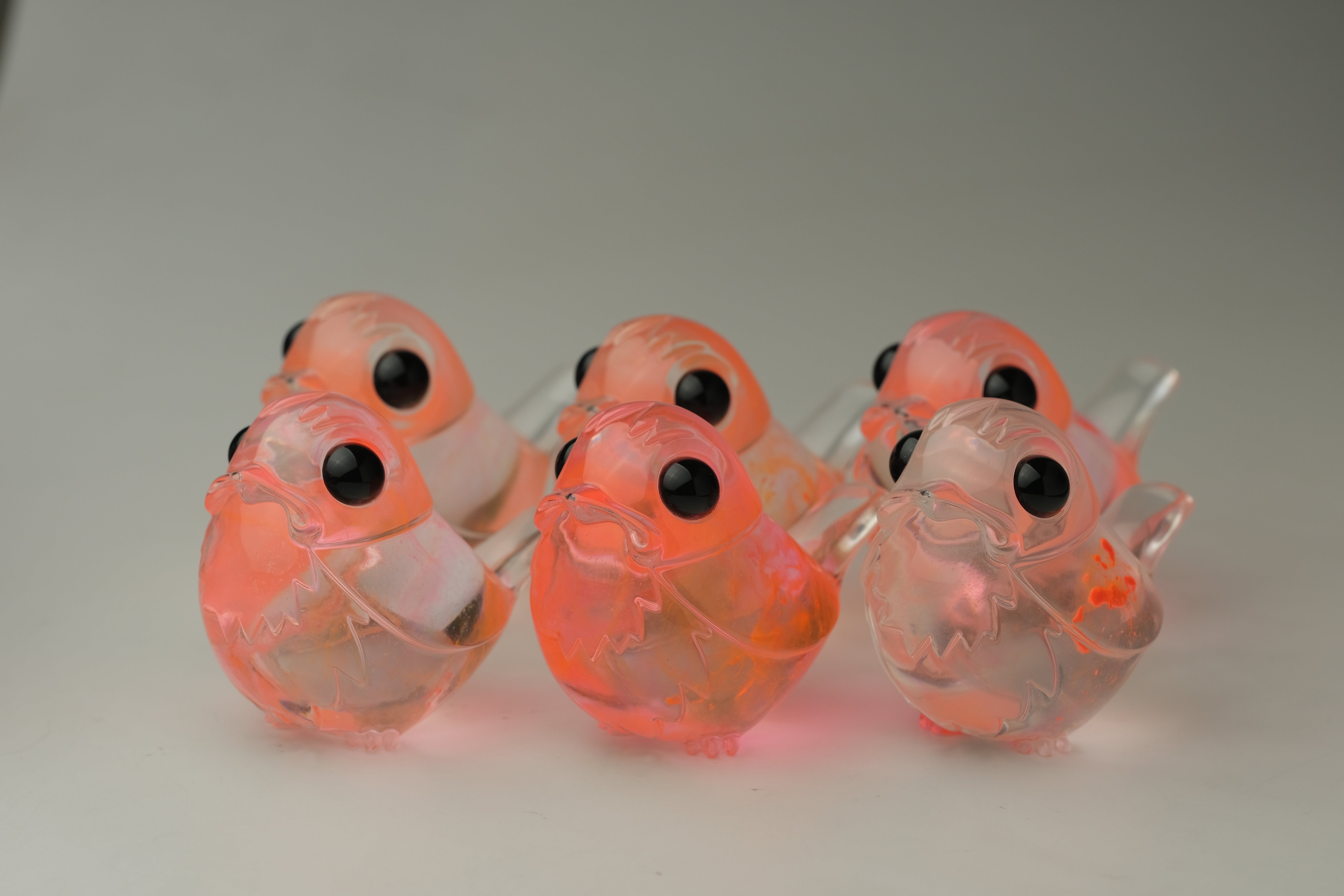 Six Pink Twinkle Robin figurines by Muffin Man, crafted from high-grade resin, featuring glossy black eyes, limited to 100 pieces, displayed in two rows.