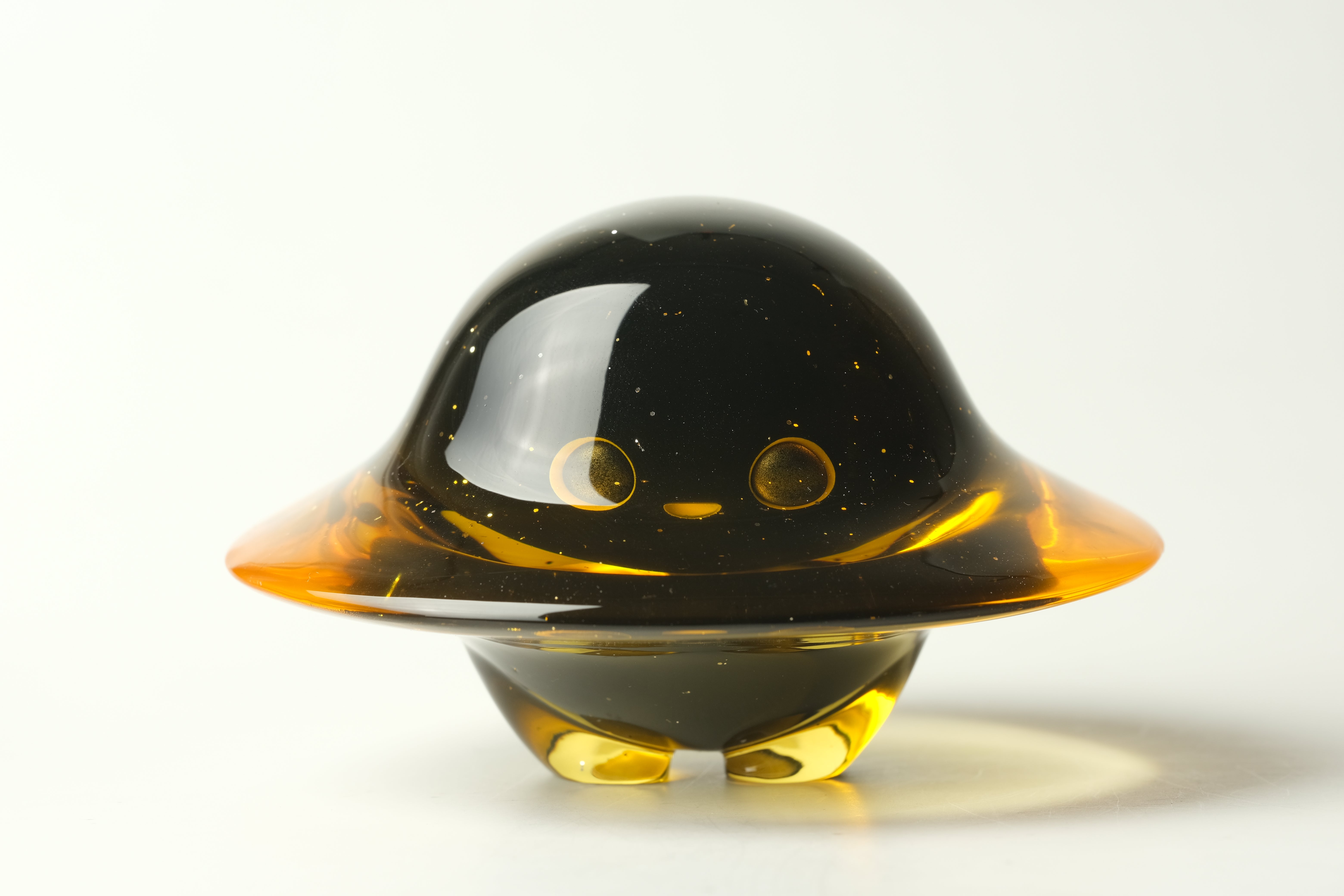Darkmite by Yutoos: a unique, 3.5 resin alien-shaped sculpture with round eyes, a mouth, a wide brim, and stubby feet. Edition of 50.