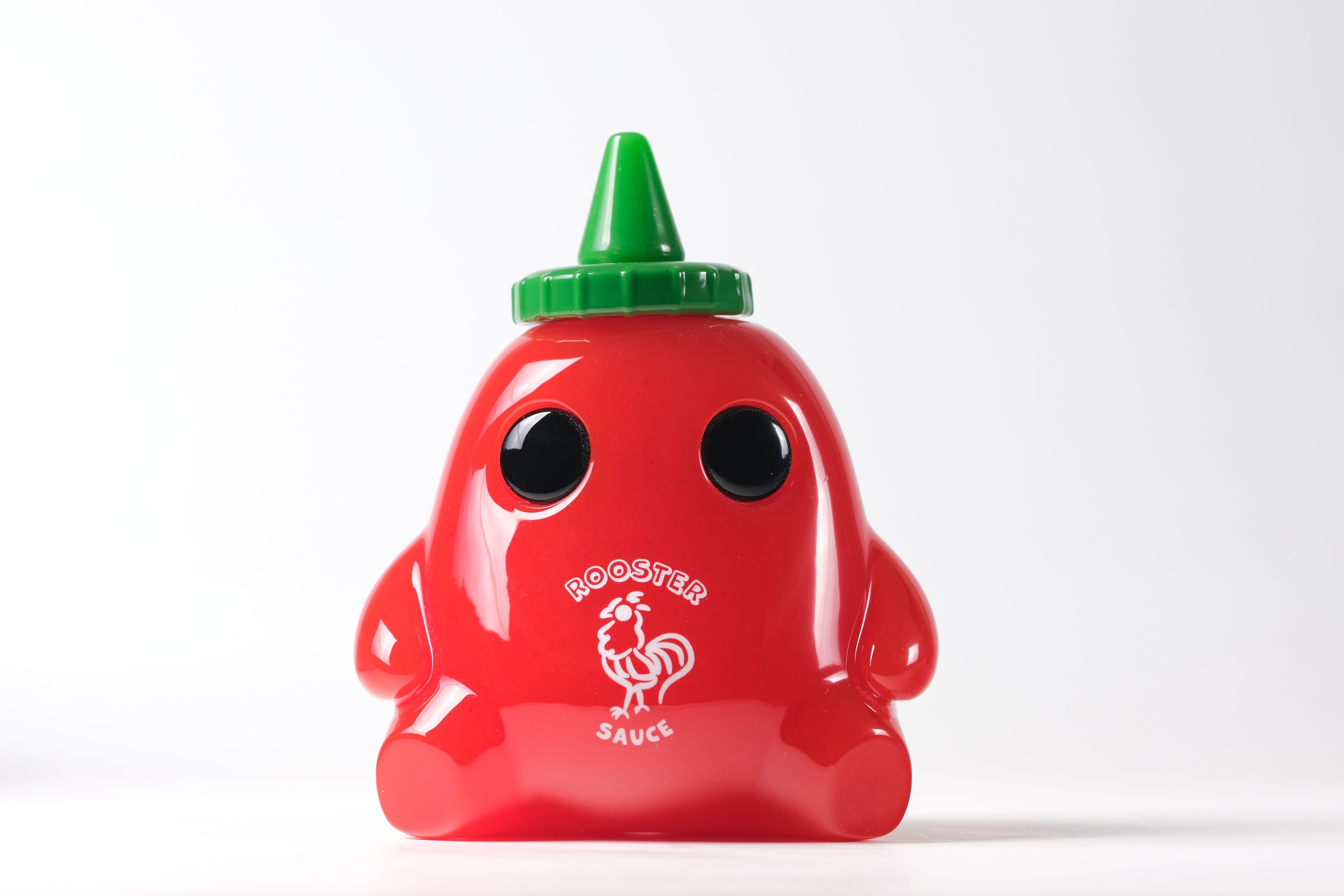 Stubby Rooster Sauce by The Lostlings: A 3.5 resin novelty dispenser with arms, legs, and eyes, featuring a rooster illustration on the front. Edition of 50.