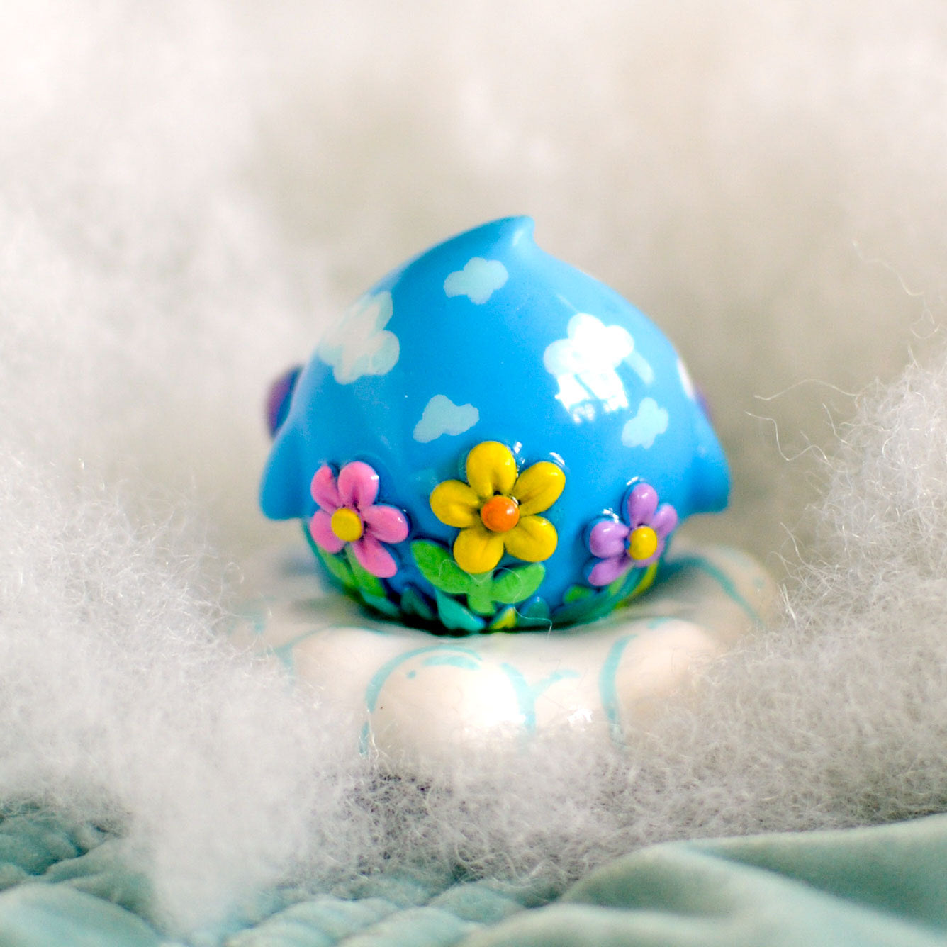 Little Shit Bigger Deal - Beasties Bites by Dear Beasties x Trash Panda, a 1.5 art toy, displayed with floral and sky elements. Limited to 10 pieces.