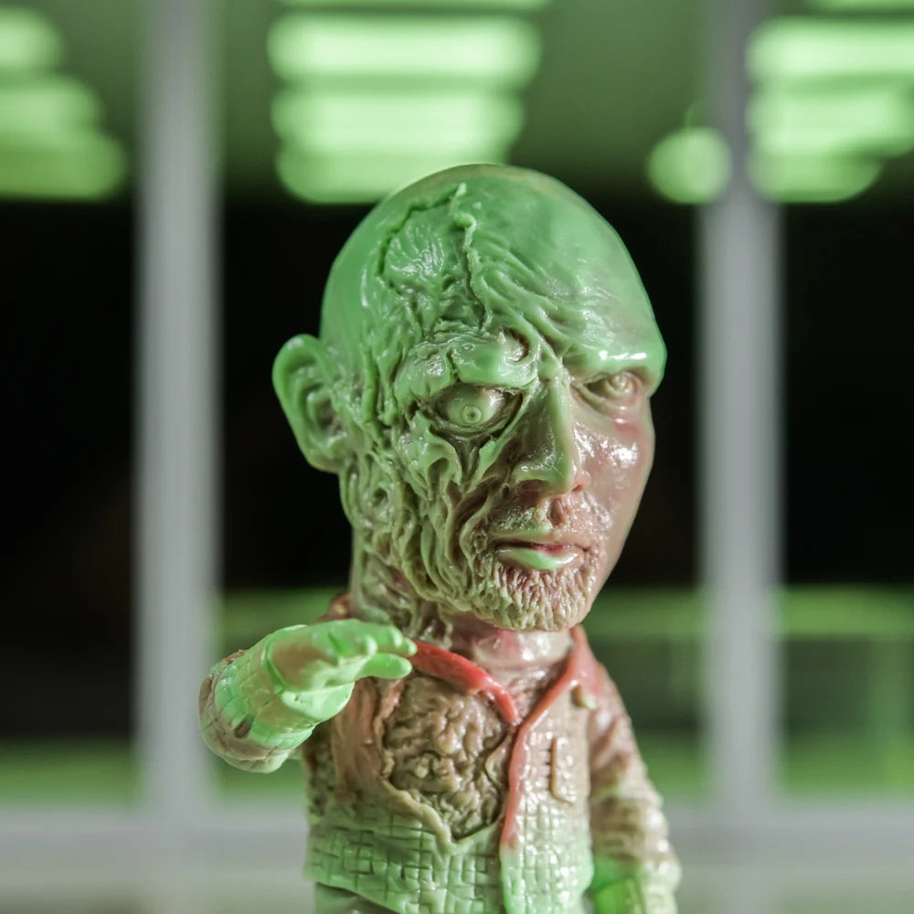 ZOMBI: DAWN OF THE DEAD Who Goes There Blind Box Series—stylized zombie figurine with exposed flesh, gaunt face, by Naoki Okamoto, in soft vinyl.