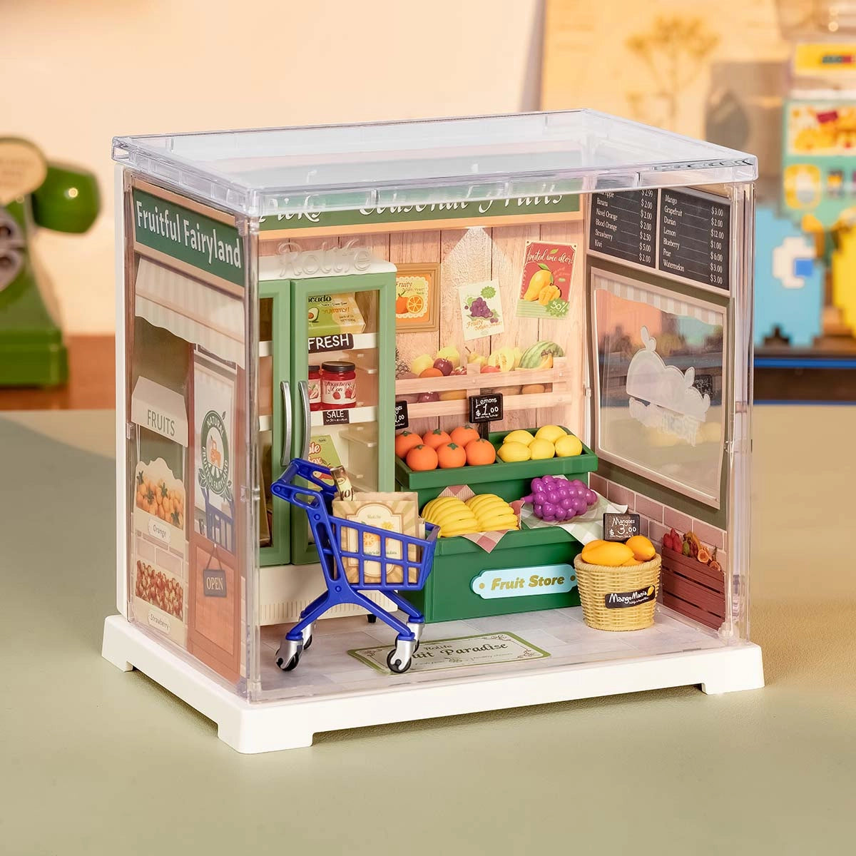 Rolife Mini Super Creator DIY Miniature House - Shop Series: A detailed fruit store diorama with produce stand, fridge, shopping cart, and signage in a clear display cube.
