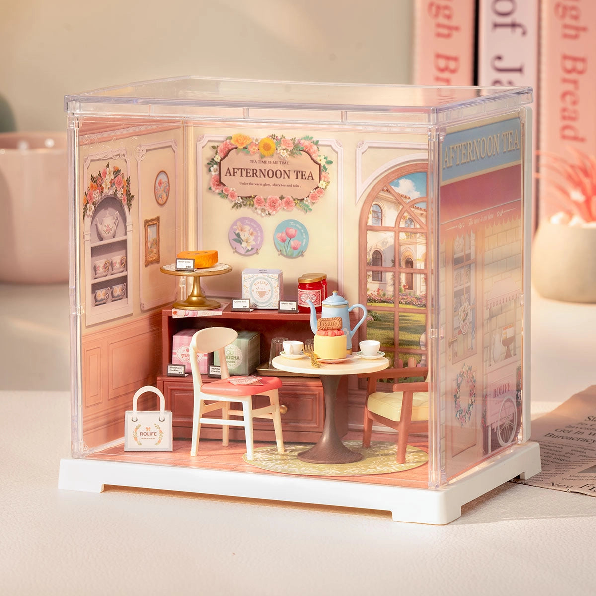 Rolife Mini Super Creator DIY Miniature House - Shop Series features a detailed diorama of a cozy café with tea sets and pastries.