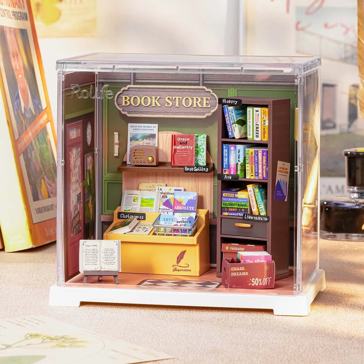Miniature bookstore diorama featuring shelves, open books, and accessories; part of Rolife Mini Super Creator DIY Miniature House - Shop Series.