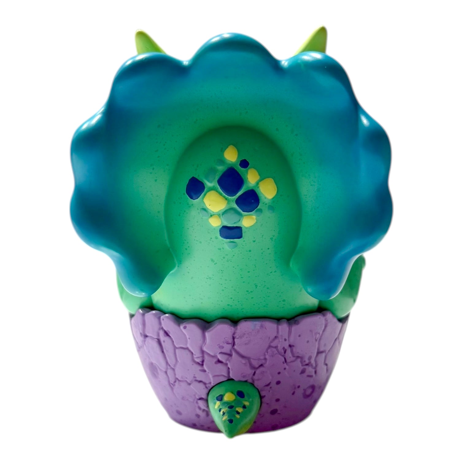 Seaside Eggtoof by Chris Ryniak - Preorder: A 4.5x4 vinyl art-toy plant-monster in a cracked purple pot, featuring teal mane, yellow horns, and diamond facial markings.