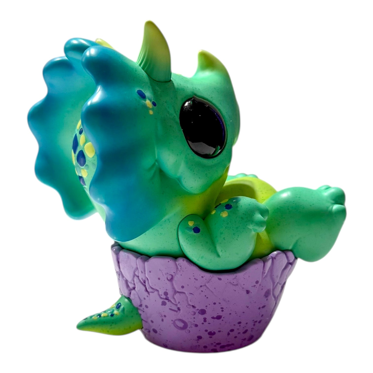 Seaside Eggtoof by Chris Ryniak - Preorder: A turquoise baby dinosaur figure in a purple eggshell, limited edition resin collectible, available from Strangecat Toys.