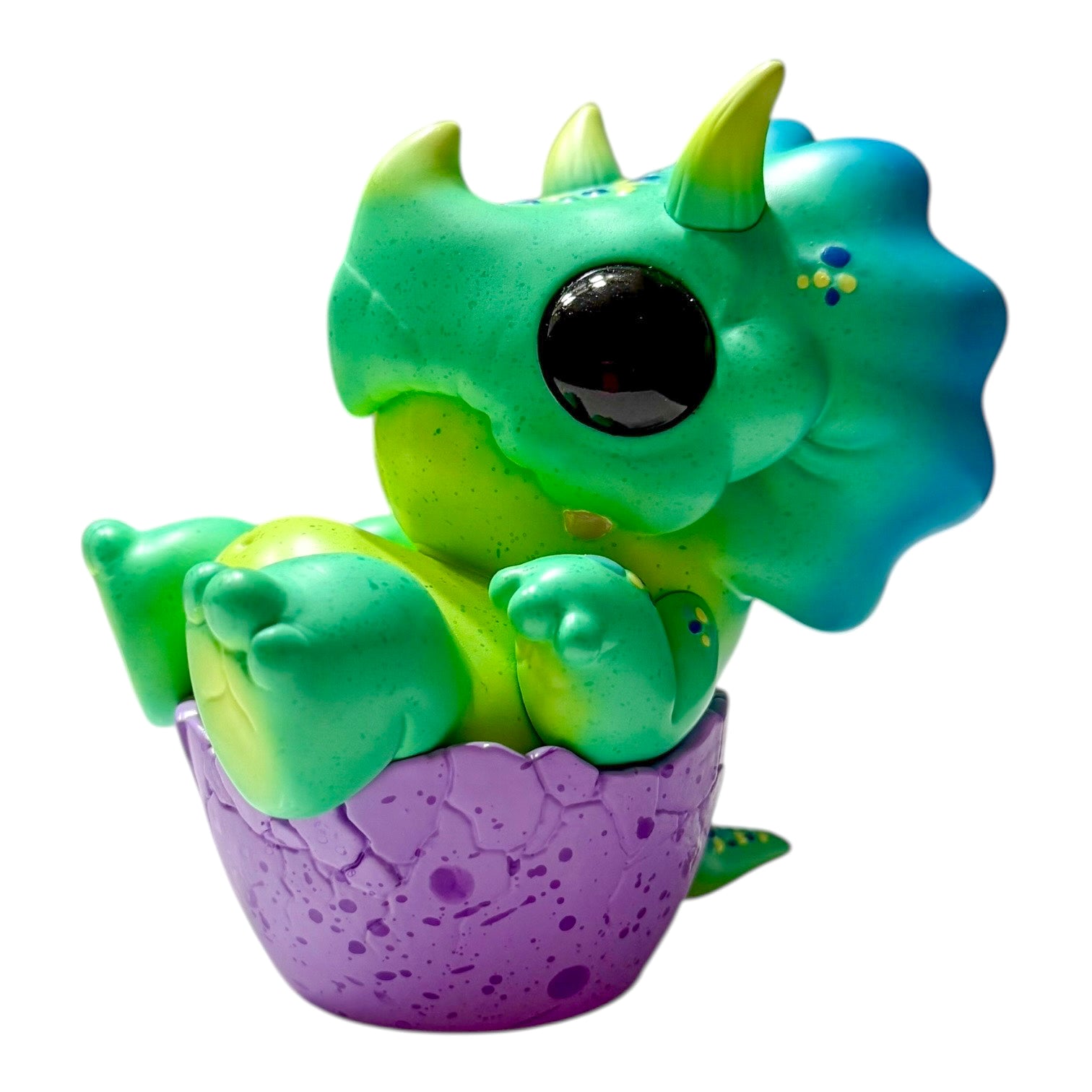 Seaside Eggtoof by Chris Ryniak: A bright green baby dinosaur in a purple eggshell, resin figurine, 4.5x4, limited to 75 pieces, available for preorder.