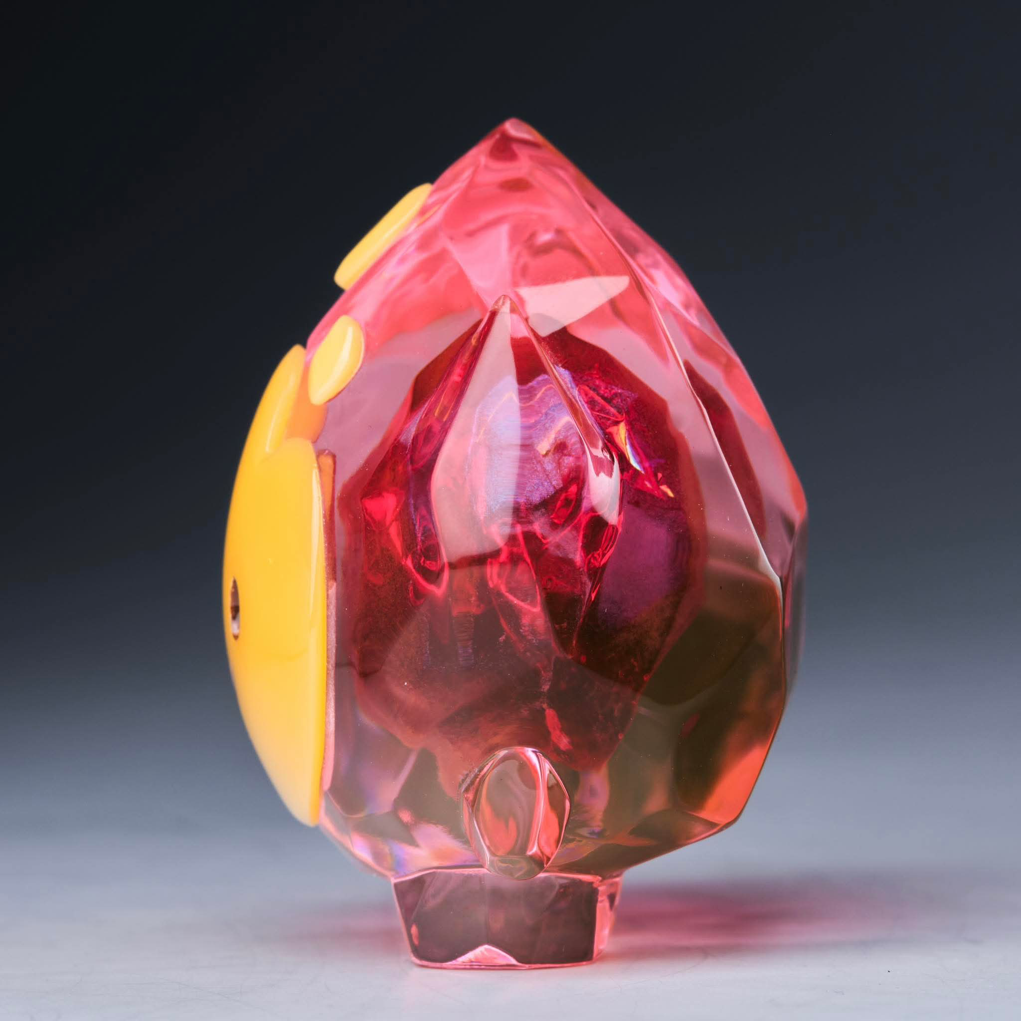 FLAMEY FROST by MUPA Toy - Preorder: Translucent pink resin sculpture with red core and yellow panel, on clear base. Limited edition art toy, 7cm tall.