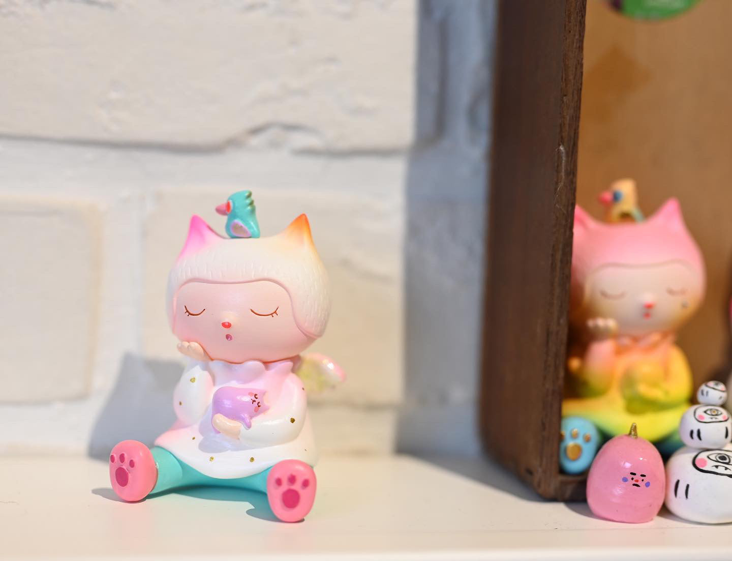Resin figurine of Sleepy Cat Angel by Hua Hua with bird, egg, and rocks, baby toys, cartoon, doll, indoor.