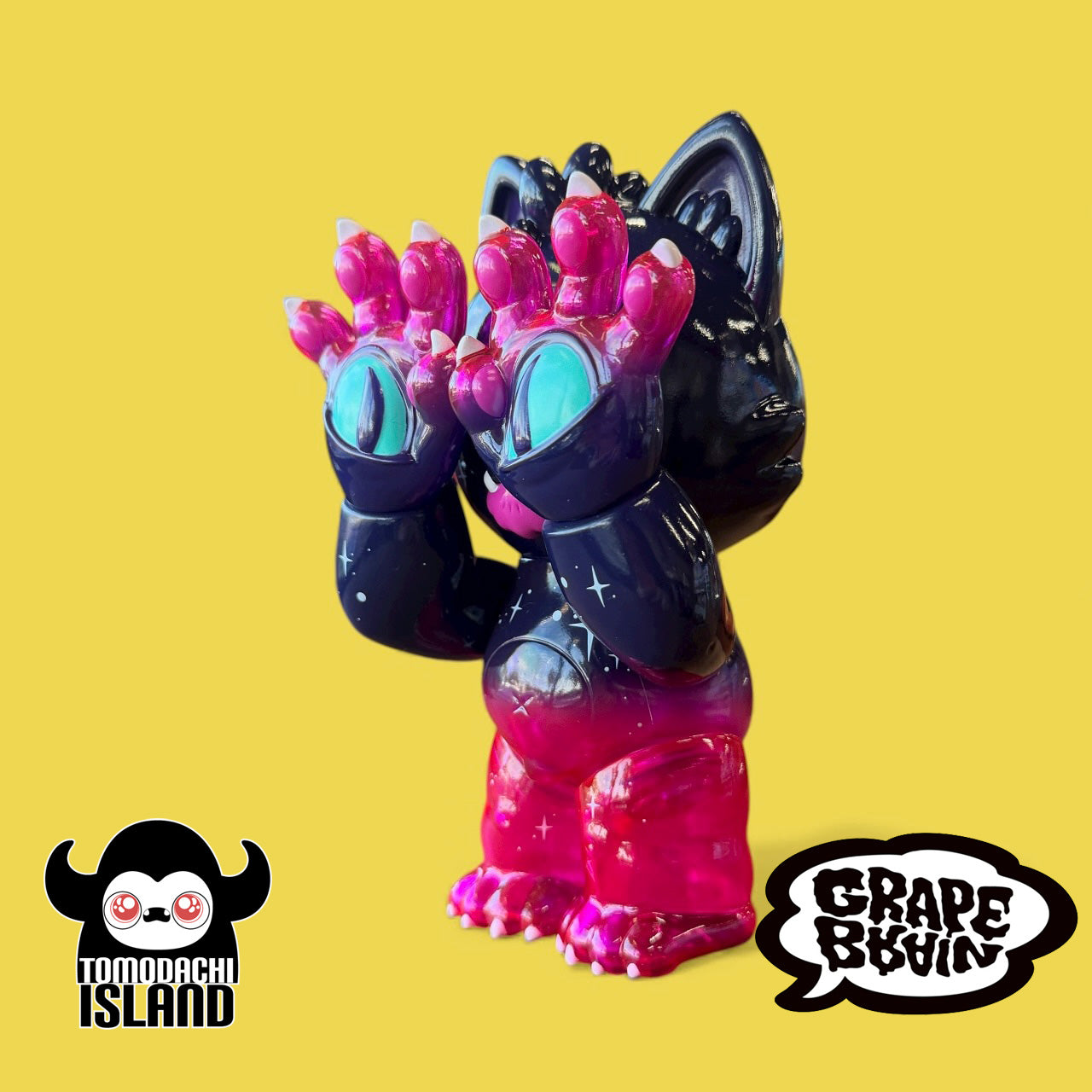 Cosmic Gramps sofubi art toy features a starry black and pink design with oversized eyes on hands, showcasing Tomodachi Island x Grape Brain collaboration.