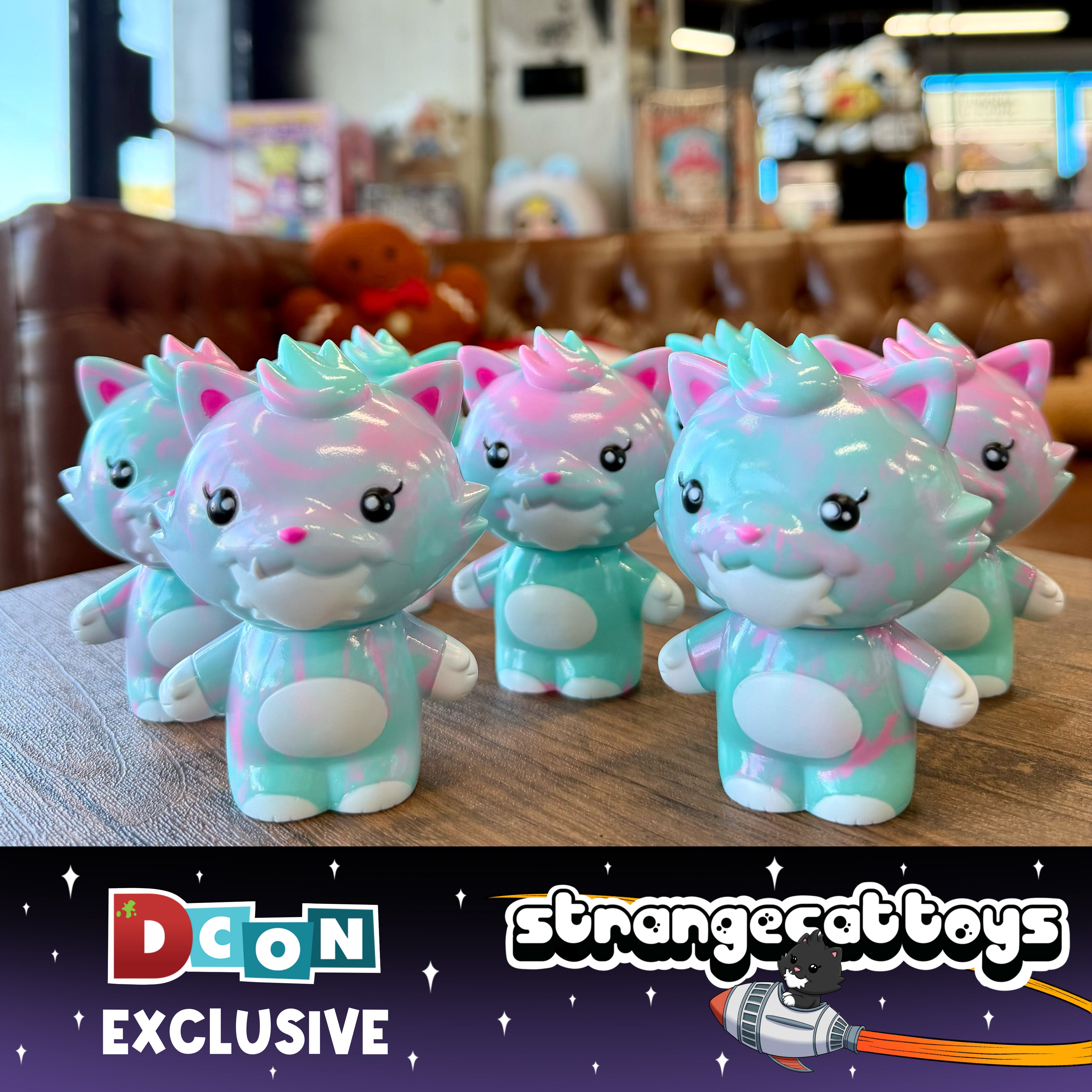 Grandpa Sofubi Marbled Turquoise & Pink, a set of six collectible vinyl cat figures with big eyes and pastel swirls, displayed on a tabletop.