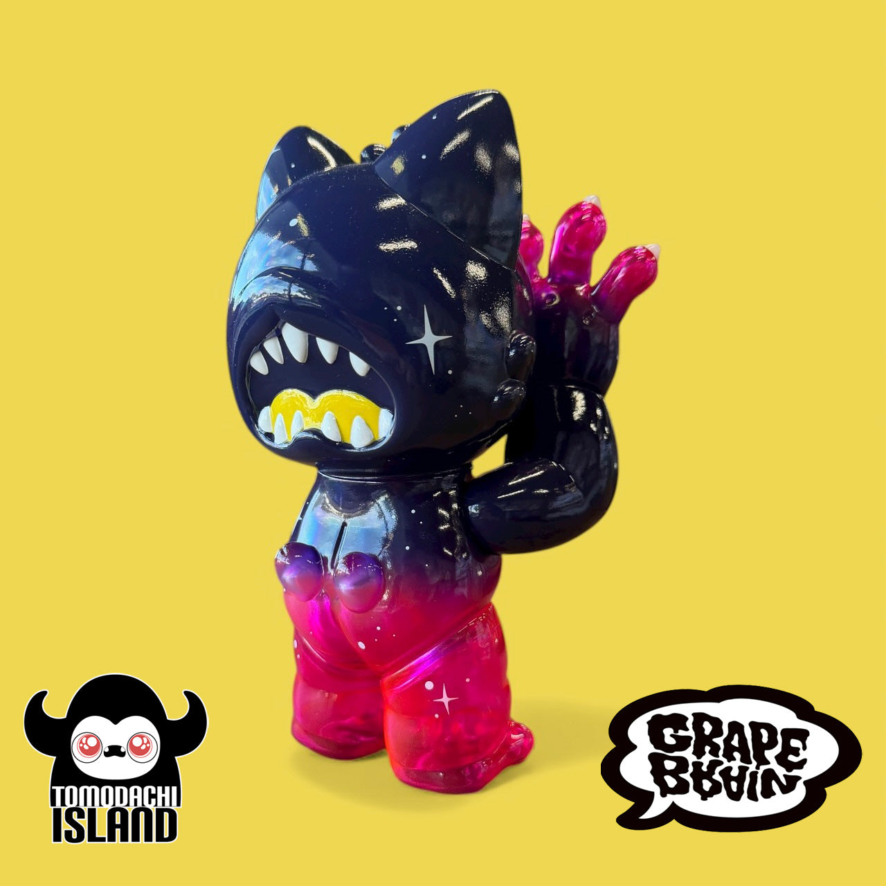 Cosmic Gramps art-toy figure, cat-like head, shark teeth, star highlights, glossy black to hot-pink fade, by Tomodachi Island x Grape Brain x Prime.