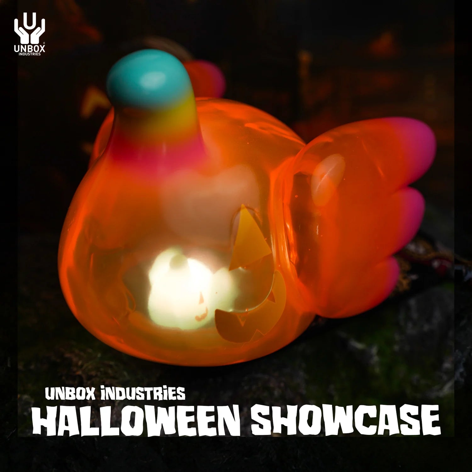 ELFIE PUMPKIN HEAD EDITION - Preorder: Translucent vinyl figure with jack-o’-lantern face, stubby wings, and glowing interior. Smooth, glossy finish featuring a multicolored horn on top.
