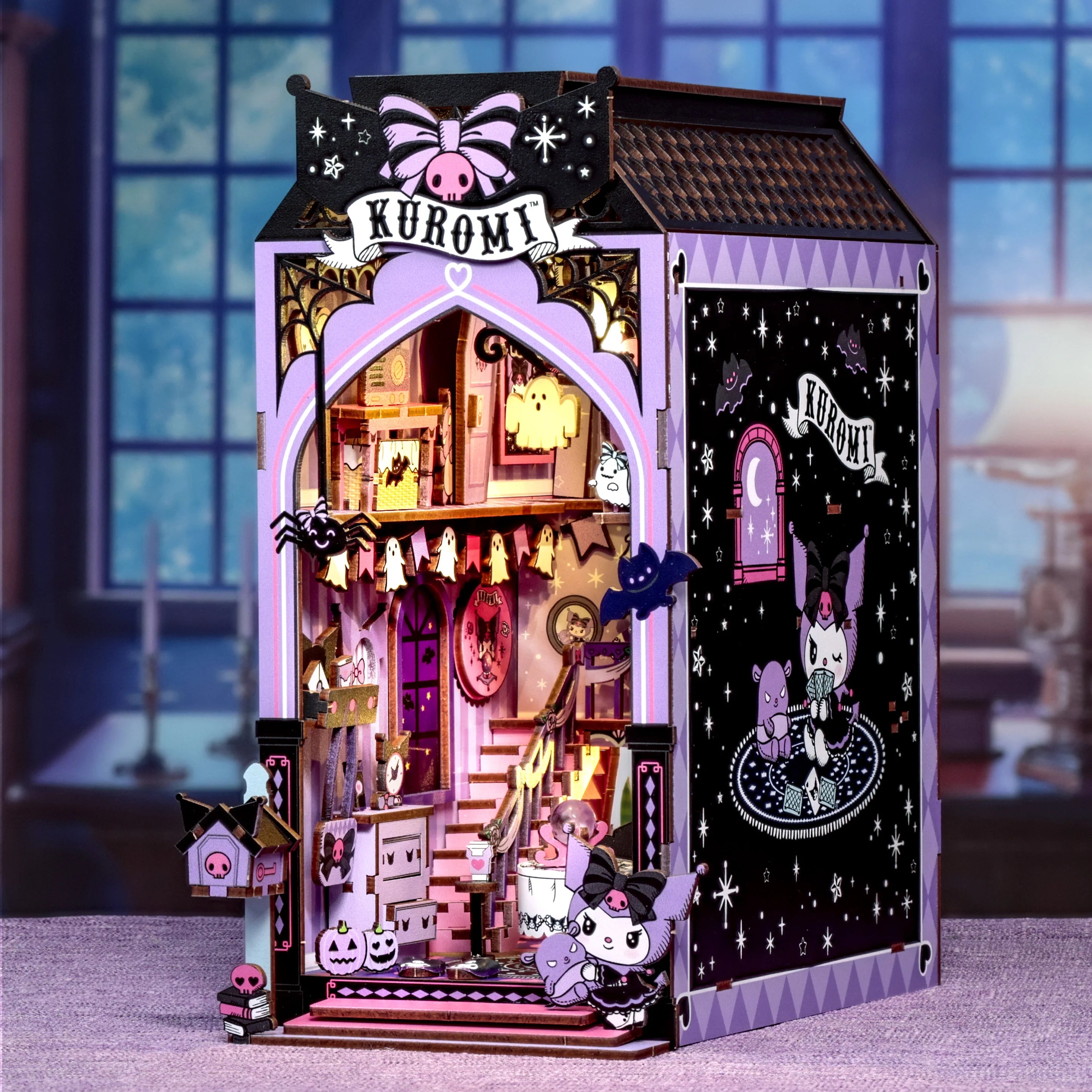 Kuromi™ Spooky House Booknook, a detailed pastel goth miniature with Halloween décor, featuring Kuromi and themed furniture, perfect for art toy collectors.