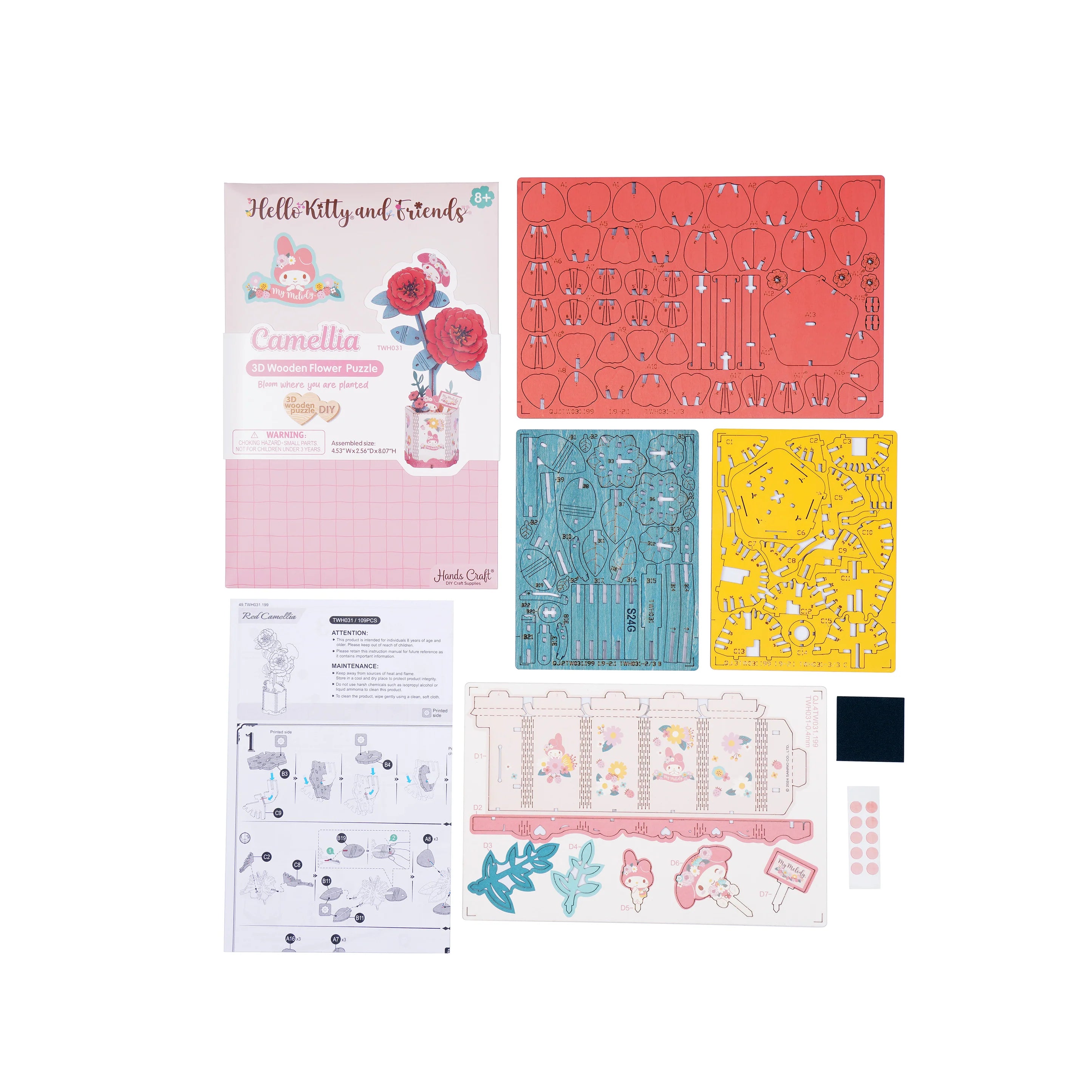Hello Kitty® and Friends My Melody Red Camellia puzzle kit contents: retail box, laser-cut panels, decorative sleeve, stickers, foam, and instruction booklet.