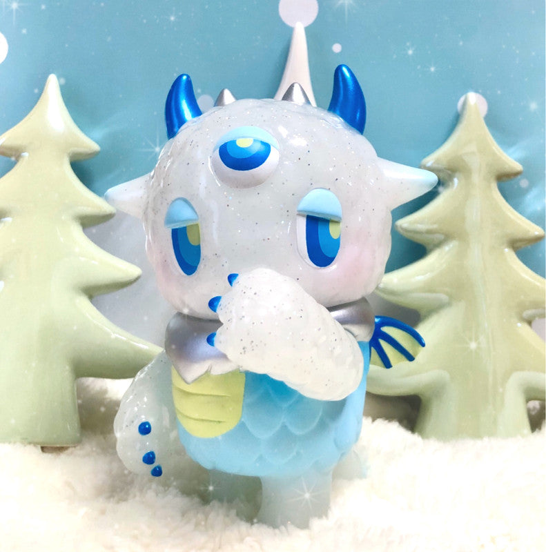 Kaiju NEMUKE Holy Snow toy figure with a white Christmas tree and blue face, a dreamy monster with a gentle demeanor.