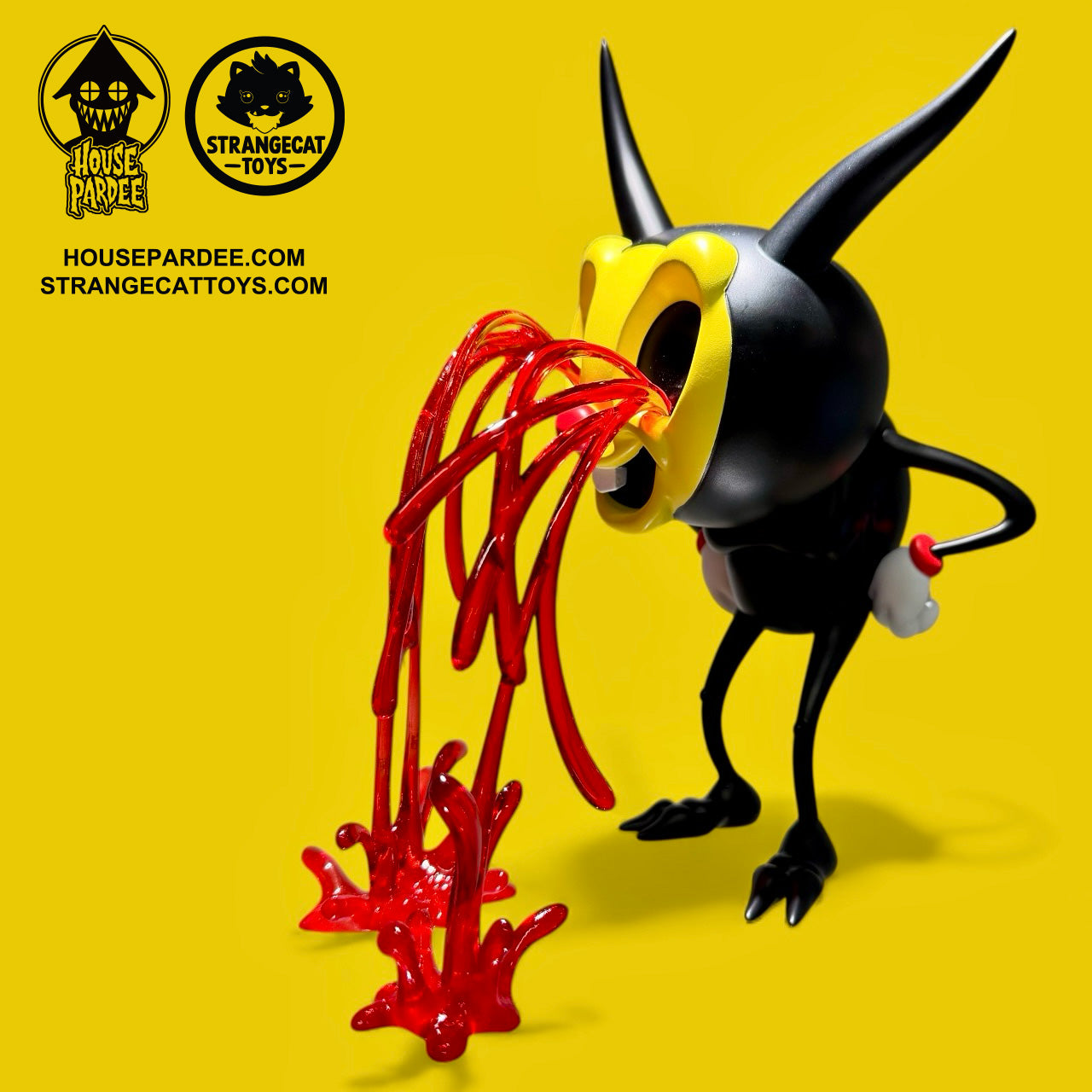 I Love My Job by Alex Pardee: A 6-inch limited edition vinyl designer toy featuring a black figure with horns and a yellow mask, releasing glossy red strands.