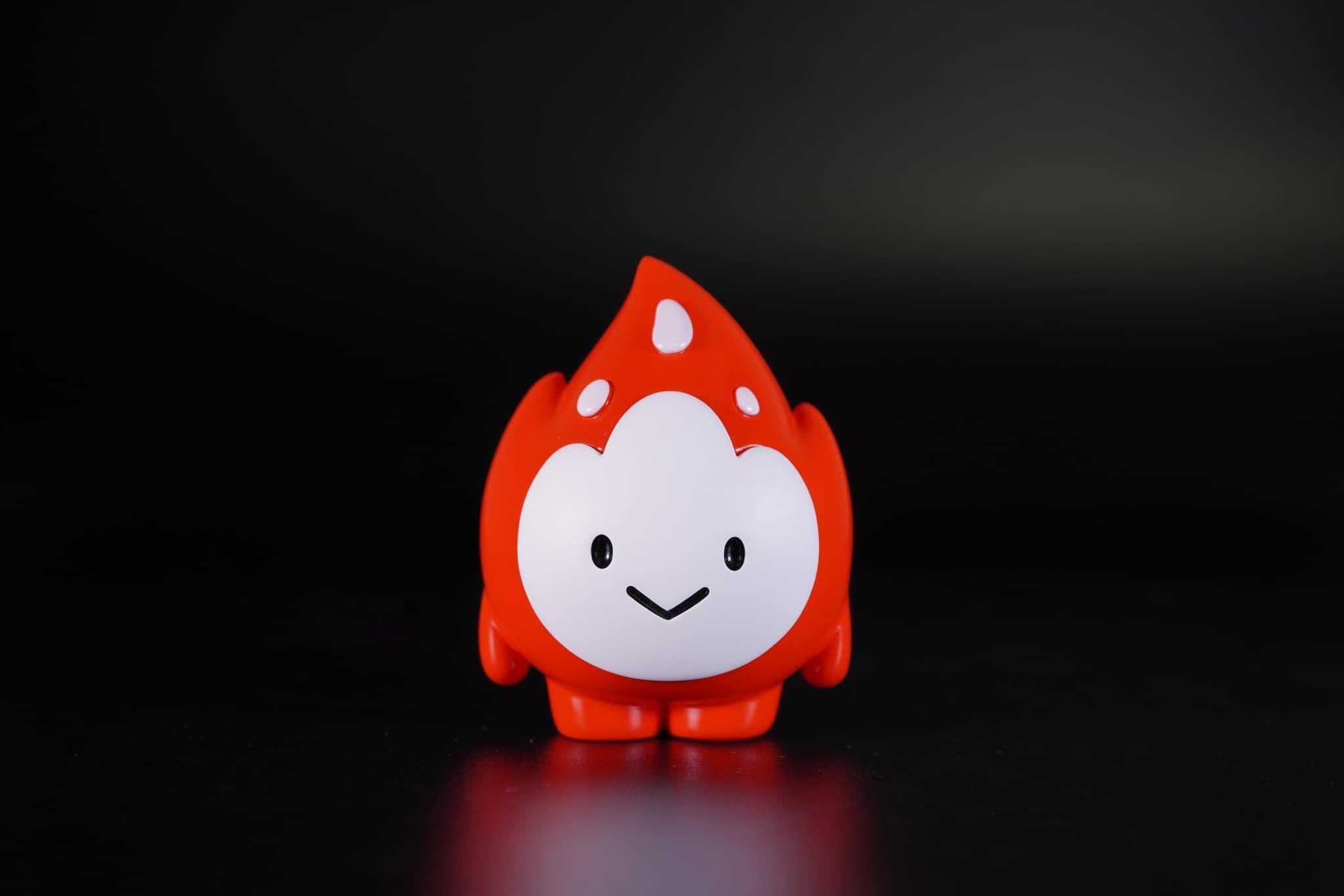 Toy of a red and white cartoon cat face with a liquid droplet, made of resin, 7cm.