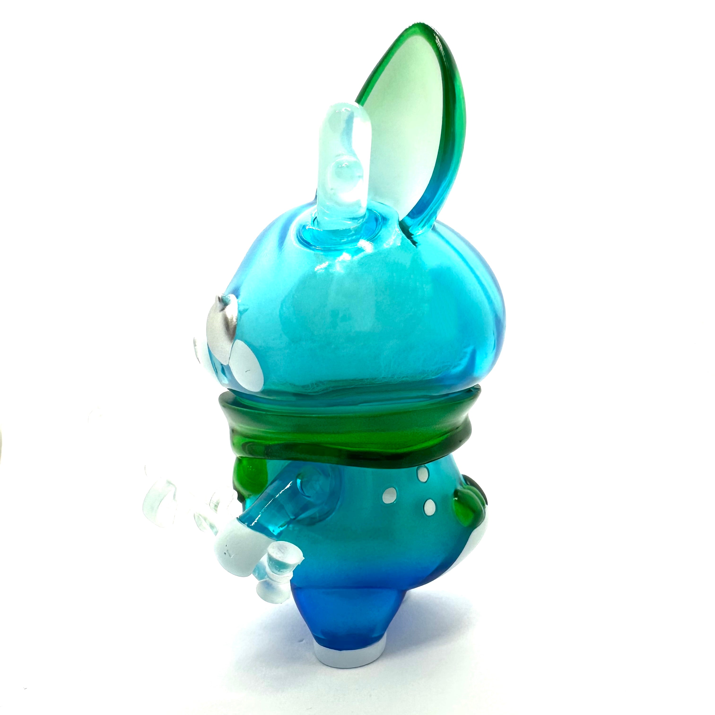 A glass toy featuring Momiji-chan Blue Pond by Asako Hashi, a character from Hokkaido, Japan, with a deer theme and a mysterious storyline.