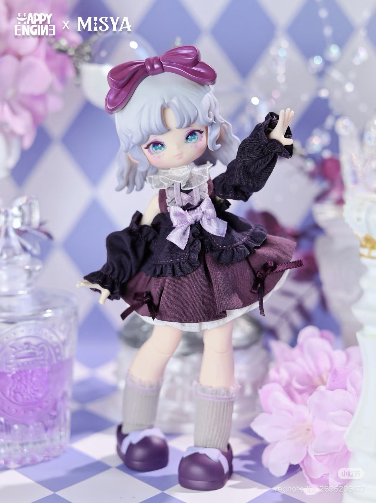 MISYA – Oddities Cabinet Series BJD Blind Box: Fashion doll with silvery-lavender hair, wearing deep plum and black layered outfit, posed on a checkerboard surface.