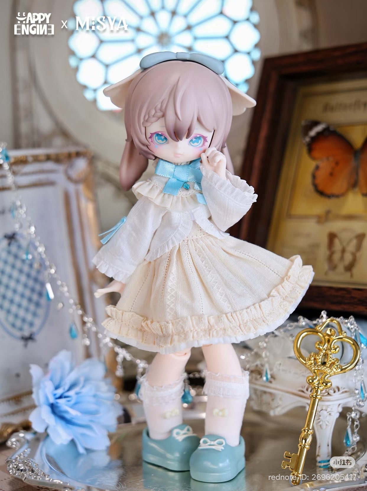 MISYA – Oddities Cabinet Series BJD Blind Box: Stylized doll with pastel-pink hair, cream ruffled dress, surrounded by fairy-tale props on a silver tray.