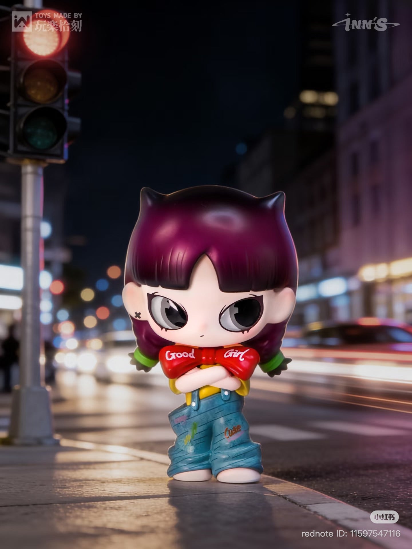 NN – I Heard It Series Blind Box: Stylized vinyl figure with cat-ear hair, crossed arms, and unique facial markings, posed against a night cityscape.