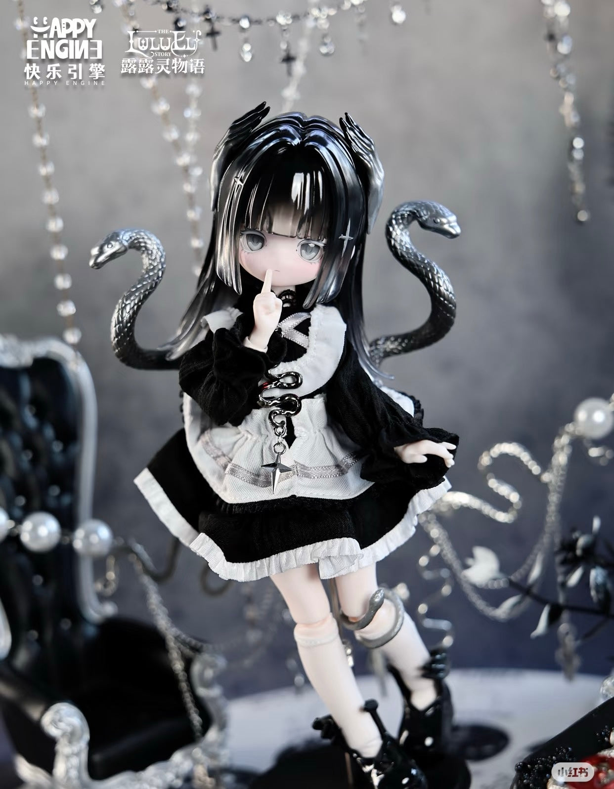 Collectible LuluELF Story resin doll in gothic-lolita outfit with serpentine motifs, framed by a dark, moody studio setup. Preorder for May 2026 shipment.