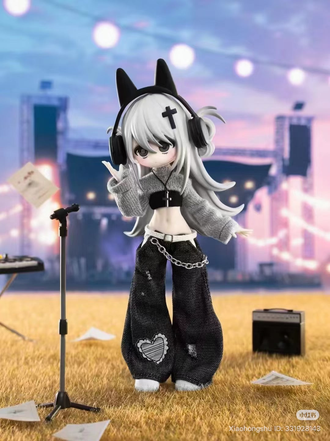 Chibi-style figurine from Ten thousand Escapes Plan 1/12 Articulated BJD Blind Box, posed on concert stage with accessories and microphone.