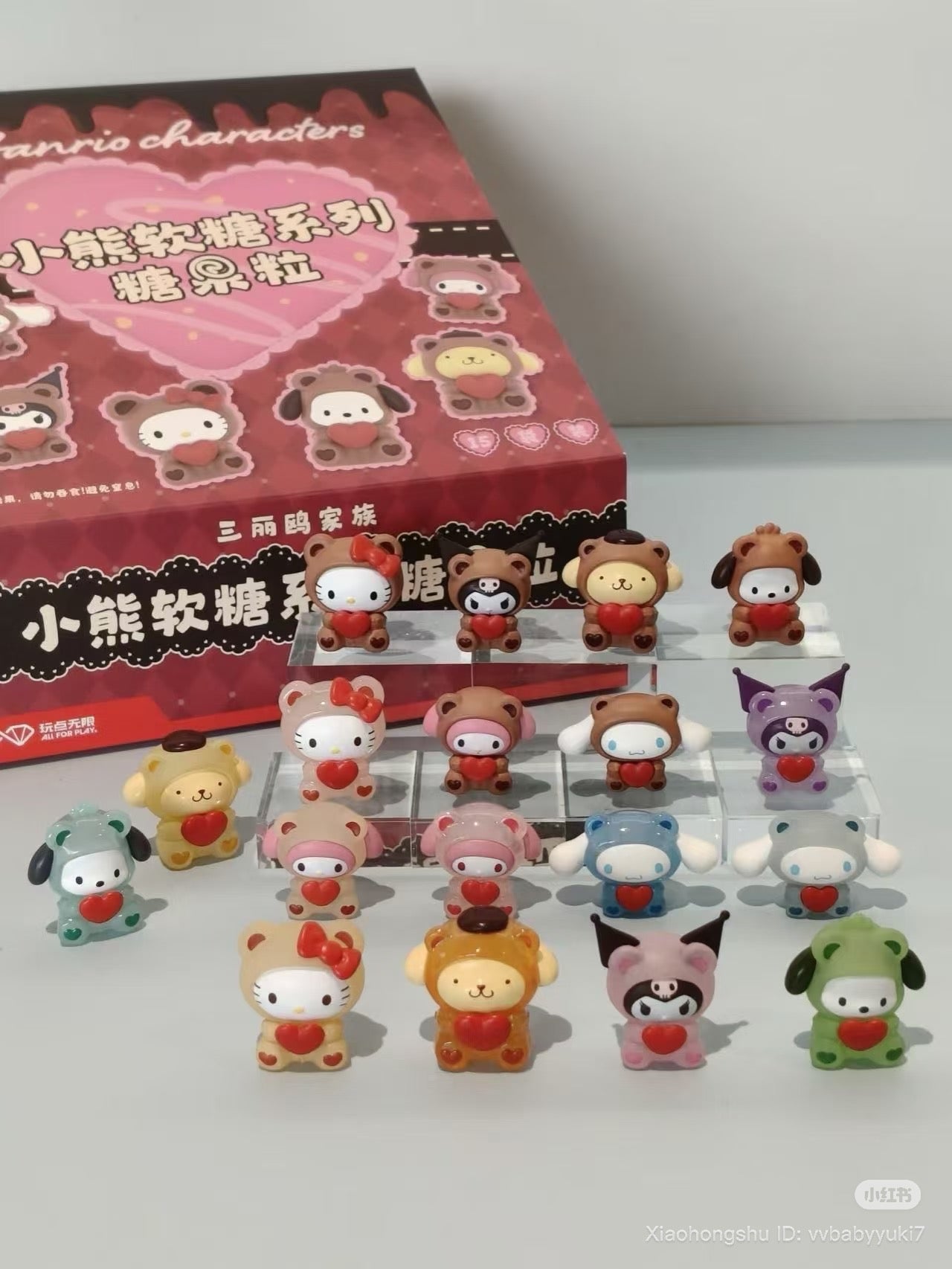 Sanrio Gummy Bears Blind Bag Bean Series - Preorder: Display of 15 mini figures in bear suits holding hearts, with a collector’s box in the background.