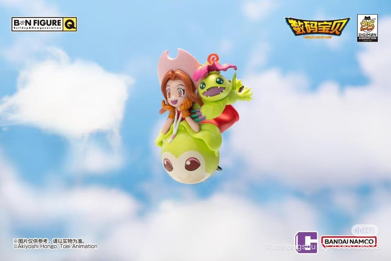 BNFIGURE Q Digimon Adventure 25th Anniversary collectible featuring chibi Mimi Tachikawa and Palmon, showcasing Bandai Namco's branding and 25th-anniversary logo.