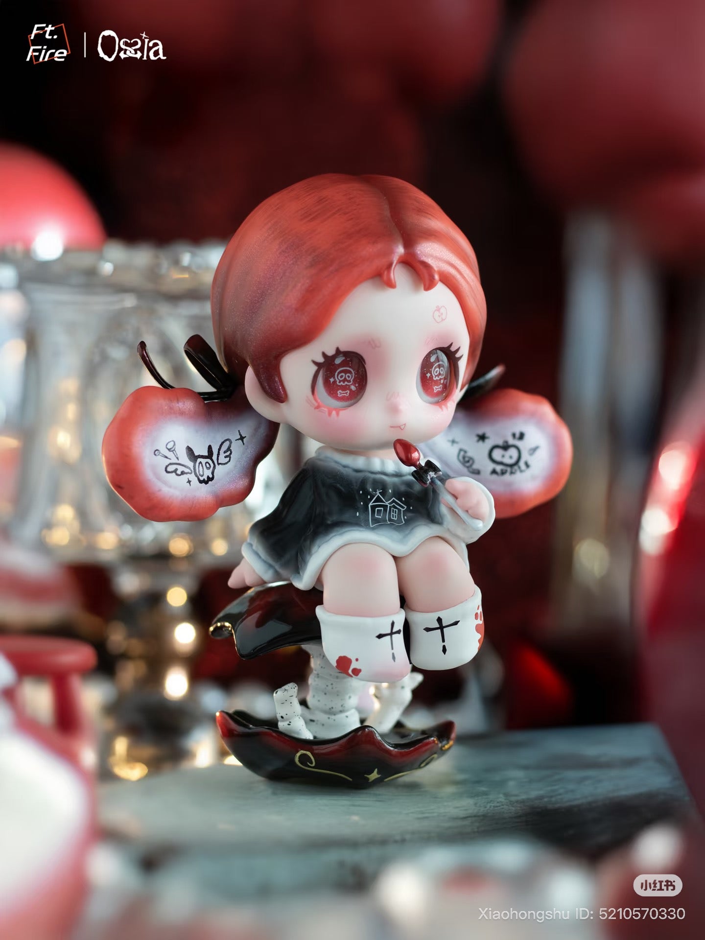 Ossia - Feel The World Series Blind Box toy: chibi figure with red pigtails, skull-eyed gaze, on a mushroom, holding a lollipop, preorder at Strangecat Toys.