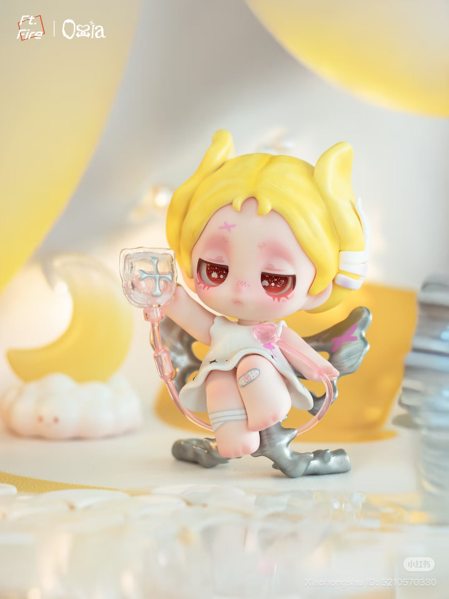 Chibi-figure angel girl with IV line, blond pigtails, on wing stand. Ossia - Feel The World Series Blind Box - Preorder at Strangecat Toys.