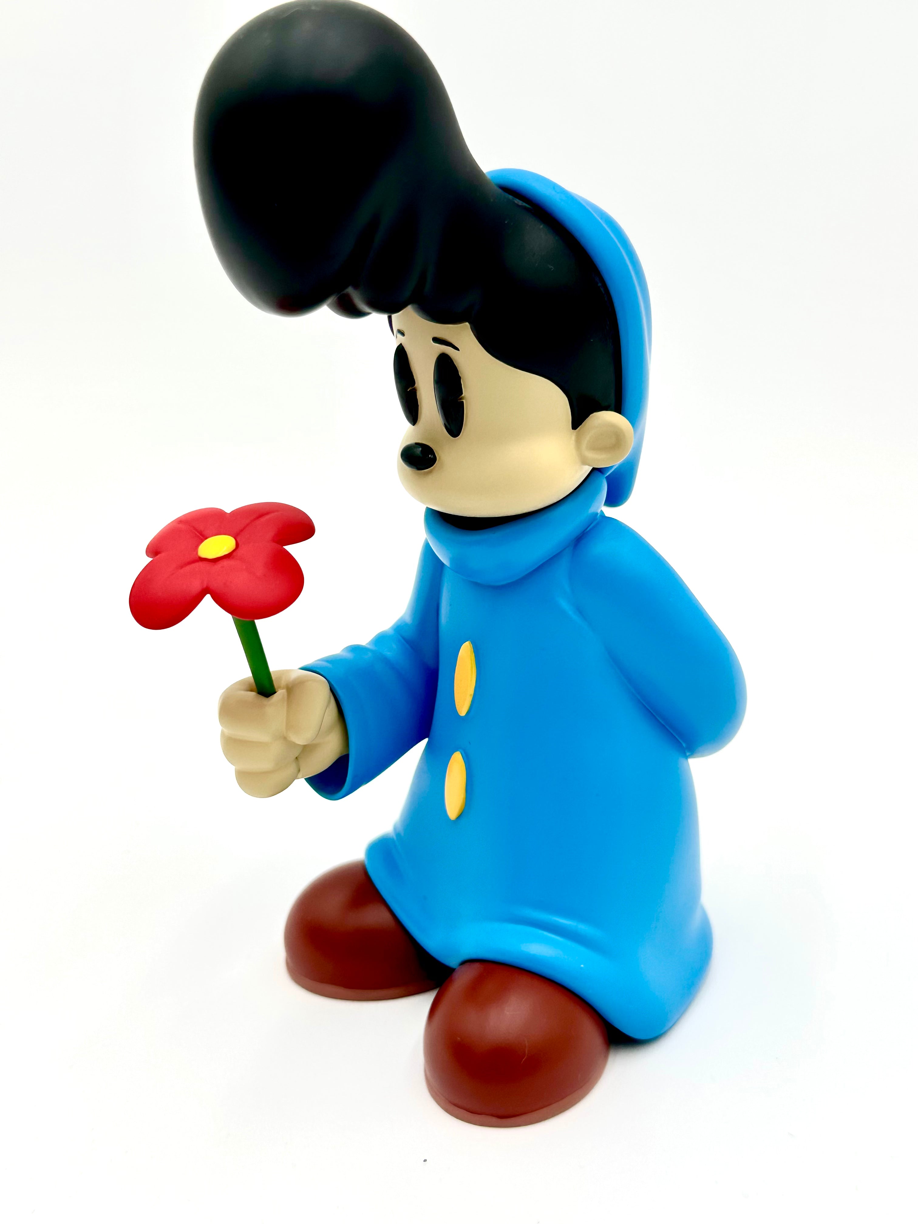 Before I Go by Ezra Brown: A 6-inch resin art-toy figure with a pompadour, blue coat, brown shoes, holding a red flower.
