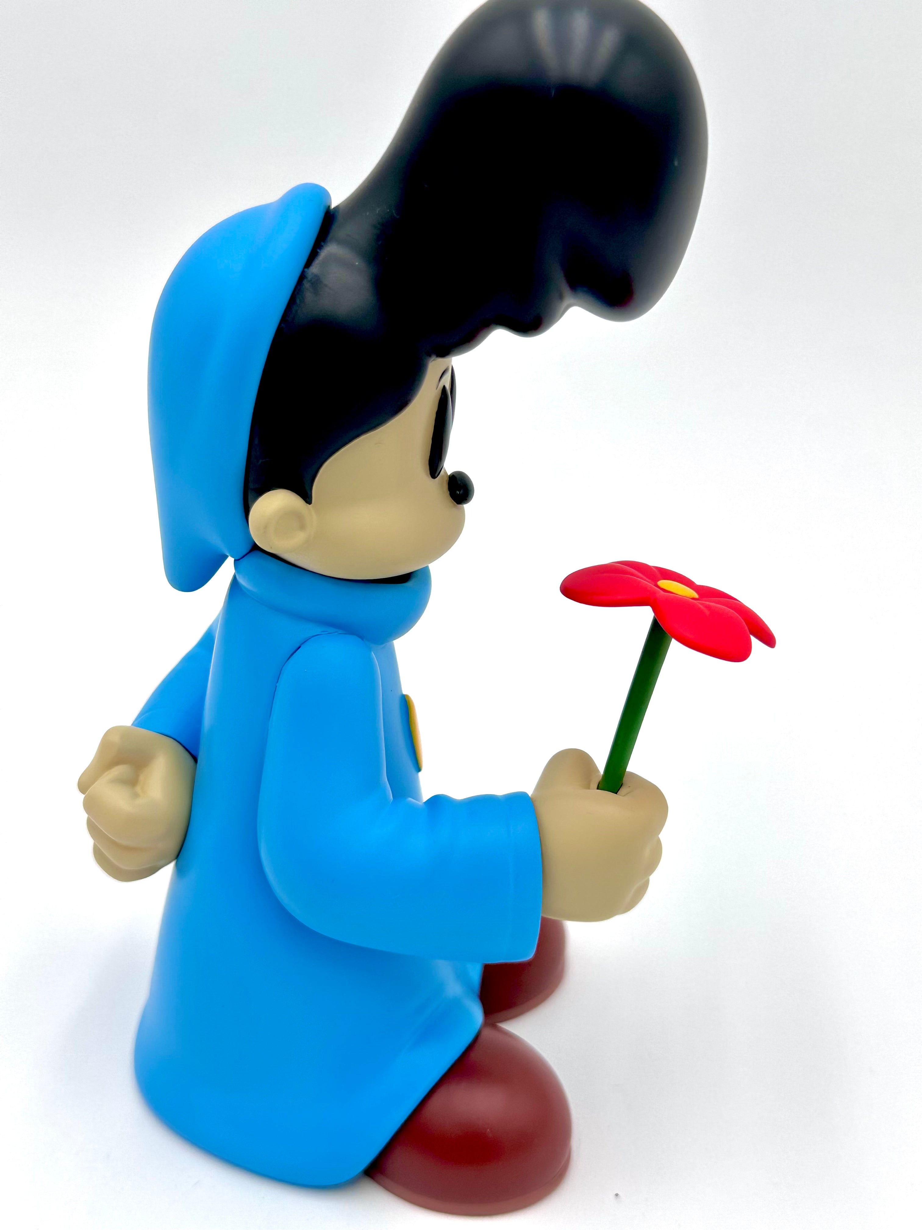 Before I Go by Ezra Brown: A 6-inch resin vinyl toy featuring a cartoon character in a blue coat, red shoes, holding a red flower.