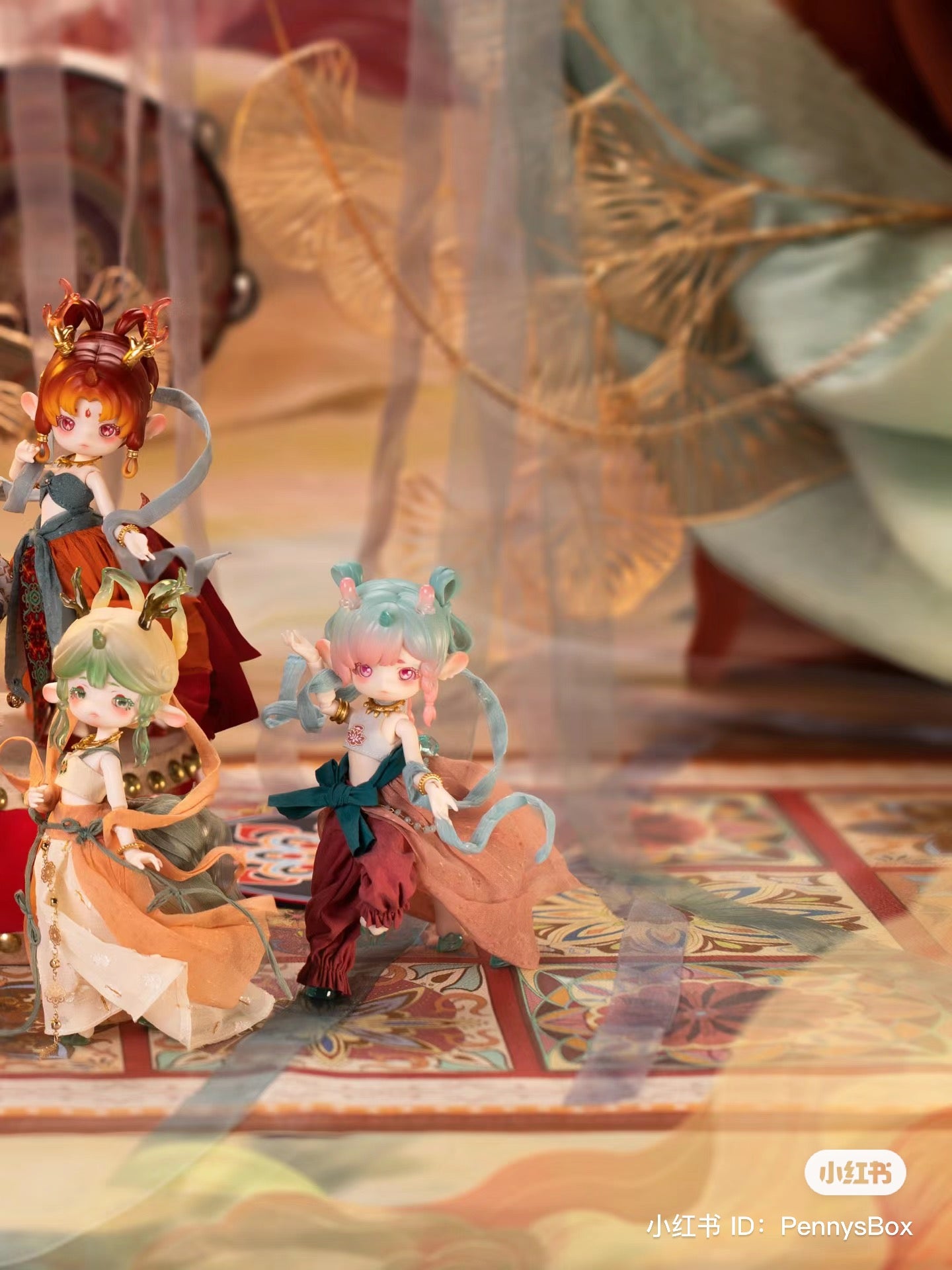 A blind box series featuring Penny Box Silk Road Souvenir BJD dolls. Includes 6 regular designs and 1 secret. Image shows various dolls with unique features like blue and pink hair.