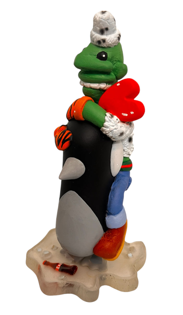 The Waddle Show - Refreshing by GoopMassta: a cartoon character statue hugging a penguin, featuring mixed media on vinyl by Chris RWK, 4 inches.