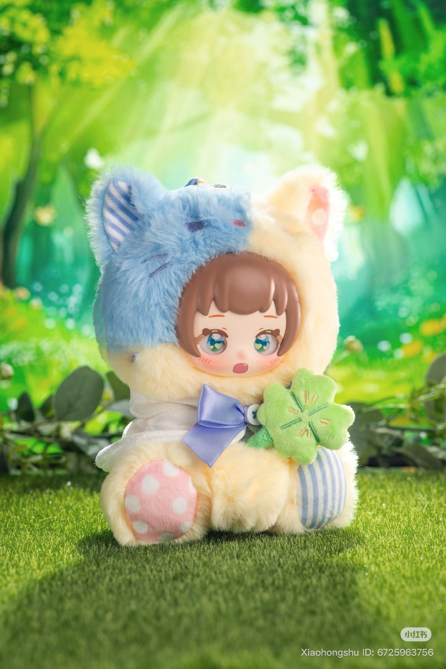 Kawaii-style plush doll in a cat-eared onesie holding a four-leaf-clover cushion, part of the NYZEE Sleeping Garden Series Plush & Vinyl Doll Blind Box.