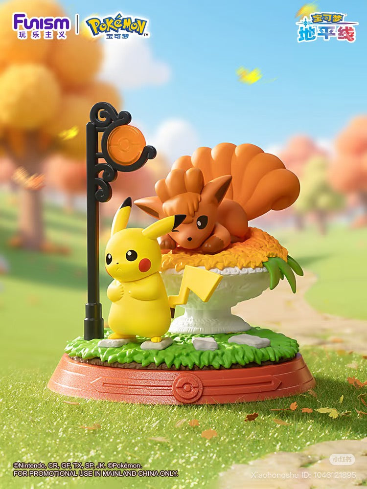 Pokémon Pikachu & Friends Series Blind Box diorama with Pikachu and Vulpix figures on a grass base, featuring promotional logos for mainland China.