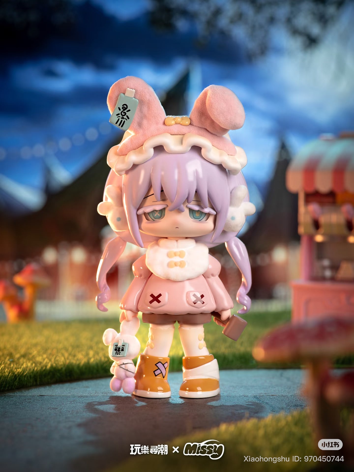 Chibi-style figure MISSY: Sweet-Gothic Lolita Crow Paradise holding plush toy and suitcase, with lavender pigtails, pink coat, and chunky boots, in a carnival setting.