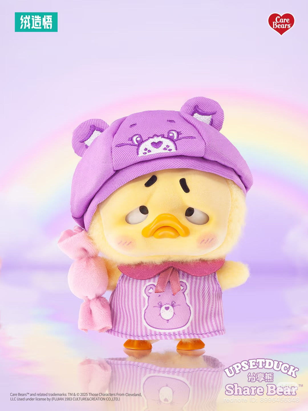 Care Bears x Upset Duck Be Rainbow Duck Plush Keychain in a Care Bears outfit with a doleful expression, set against a pastel rainbow background.