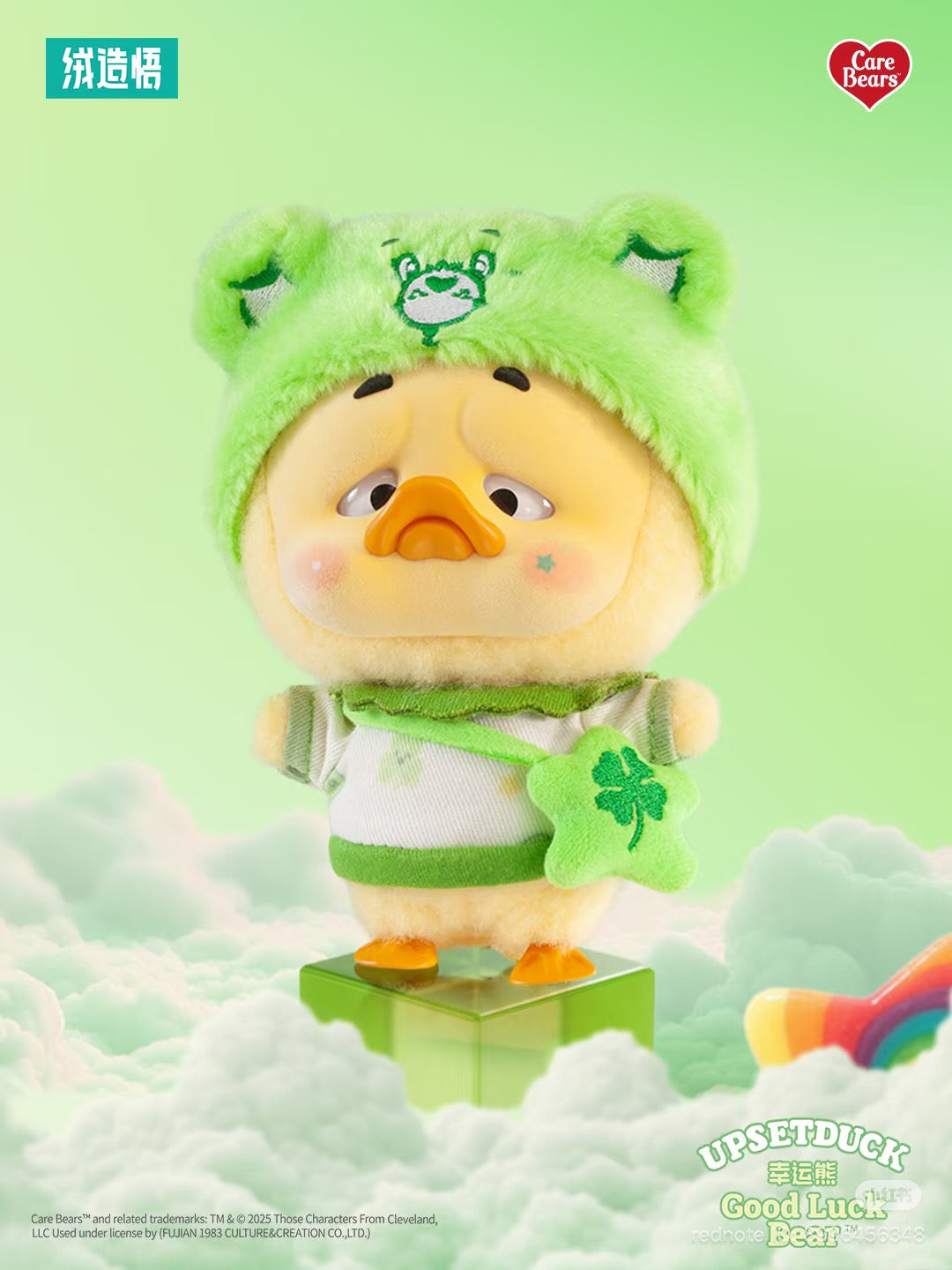 Care Bears x Upset Duck Be Rainbow Duck Plush Keychain Blind box: Duck in Good Luck Bear outfit with bear-ear hat and clover pouch on translucent block.