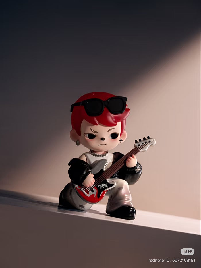 Rayan Let't Date Series figure, chibi-style with red hair, kneeling with guitar. Preorder for Strangecat Toys' blind box collection.