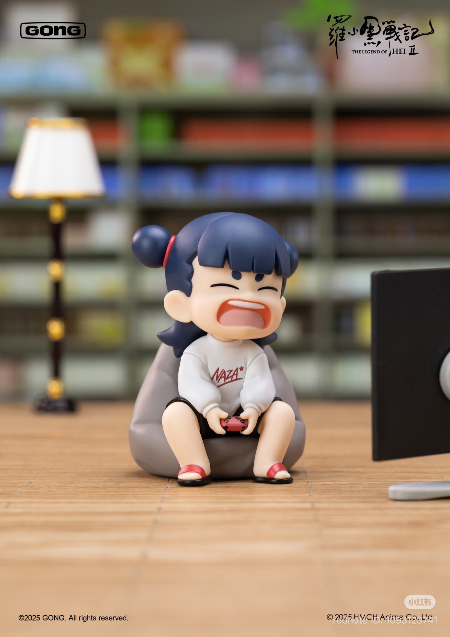 The Legend of Luo Xiaohei 2 figure, seated on a bean-bag, gaming intensely, part of a blind box series with 6 designs and 1 secret.