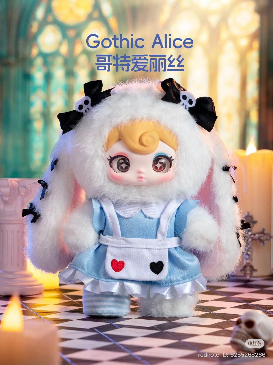 Sunycoco Rebel Sweetheart “Gothic Alice” collectible doll in bunny-hood, blue dress, on a checkerboard floor, surrounded by glowing candles. Preorder for Q4 2025 shipment.