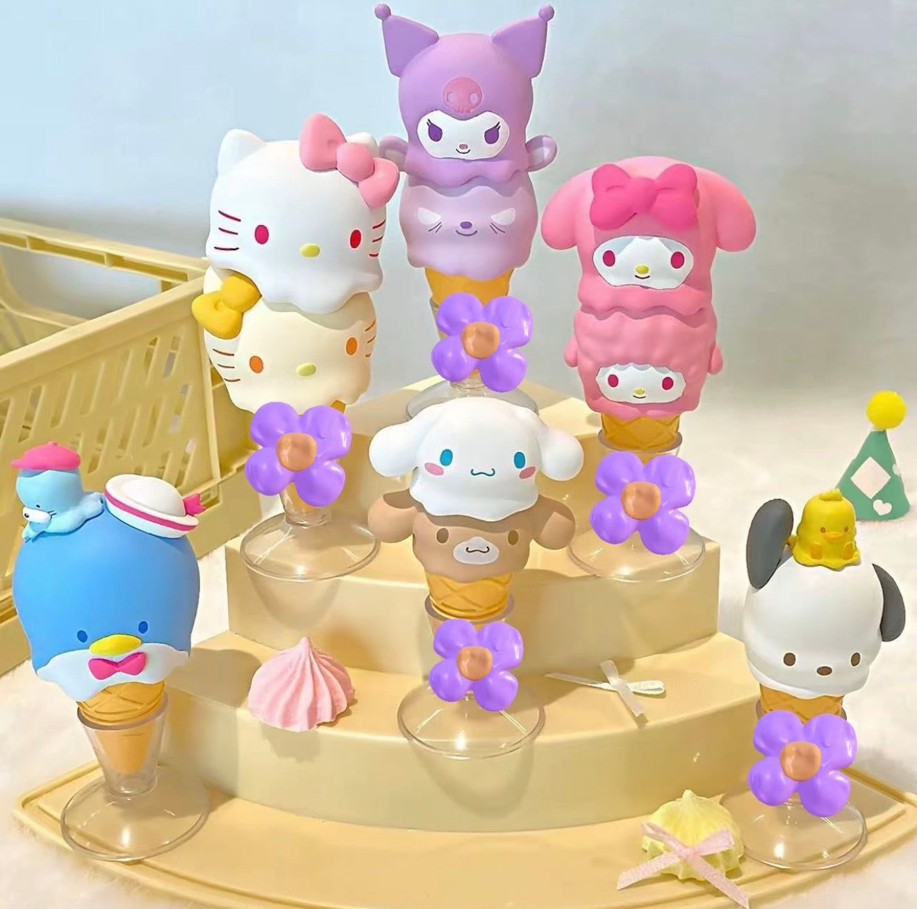 Sanrio Characters Melting Ice Cream Stacking Series Blind Box featuring stackable Sanrio figures on cones, displayed on a tiered stand with meringue-style decorations.