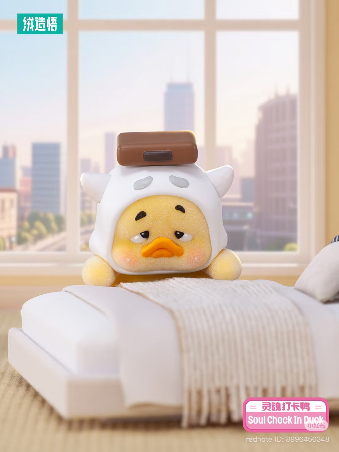 Upsetduck Status Display Duck Blind Box - Preorder: A sleepy yellow duck with a white hat and tiny cushion, resting at a bed's foot.