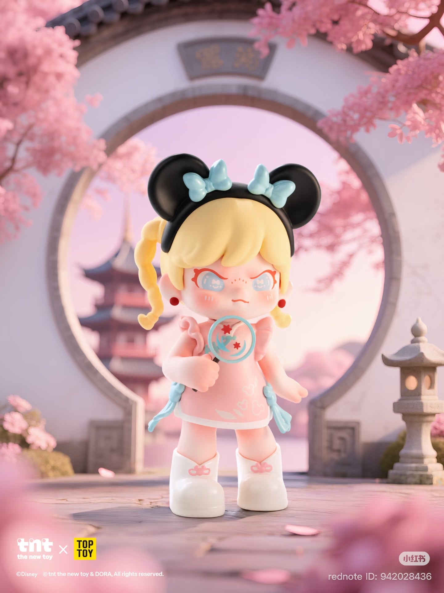 Disney DORA loves Mickey series figure in a pastel garden, holding a blue magnifying glass with red stars, surrounded by cherry blossoms and a moon gate.