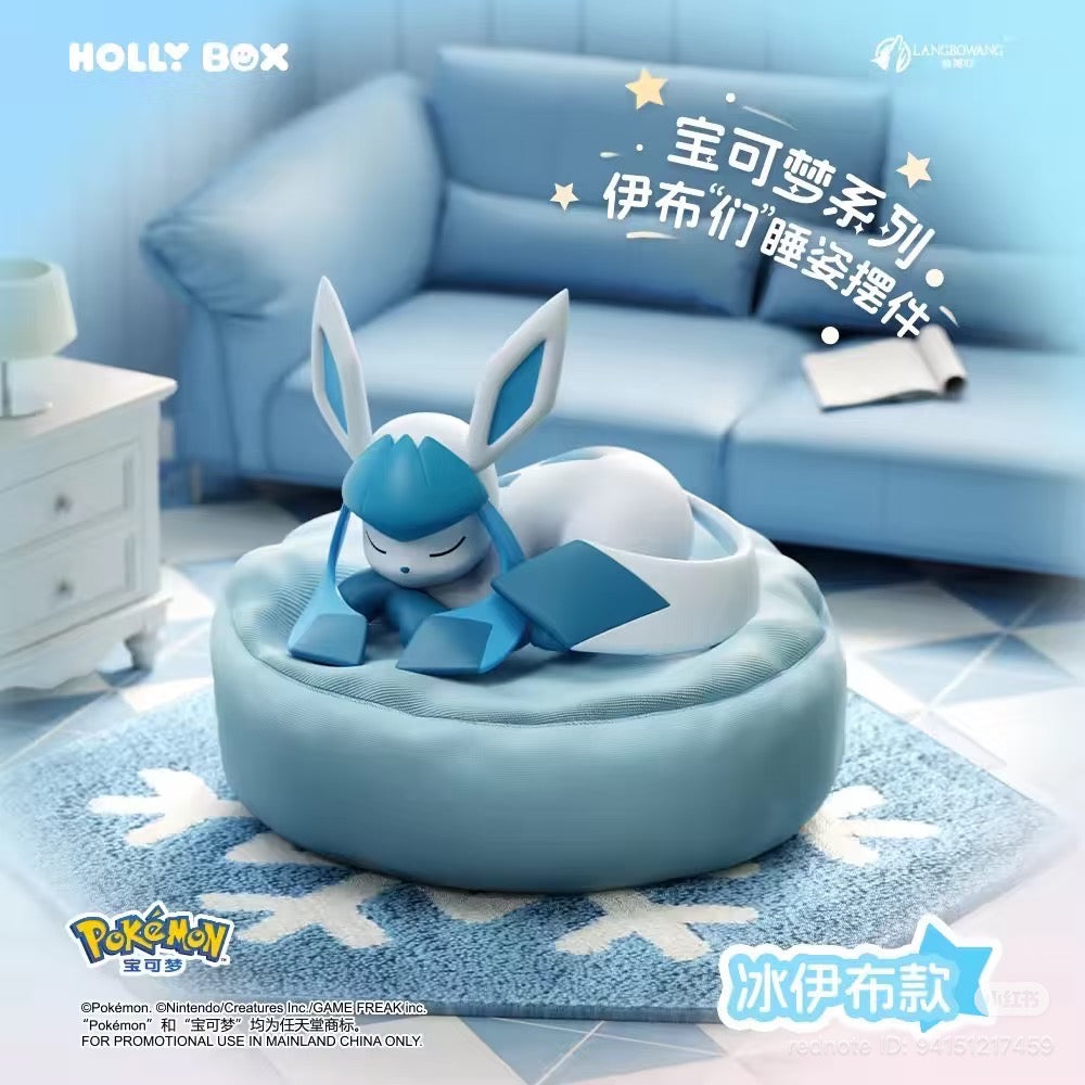 Glaceon sleeping-figurine from the Pokémon Eeveelutions Sleeping Pose Figures Series Blind Box, displayed on a light-blue cushion in a pastel-themed setting.